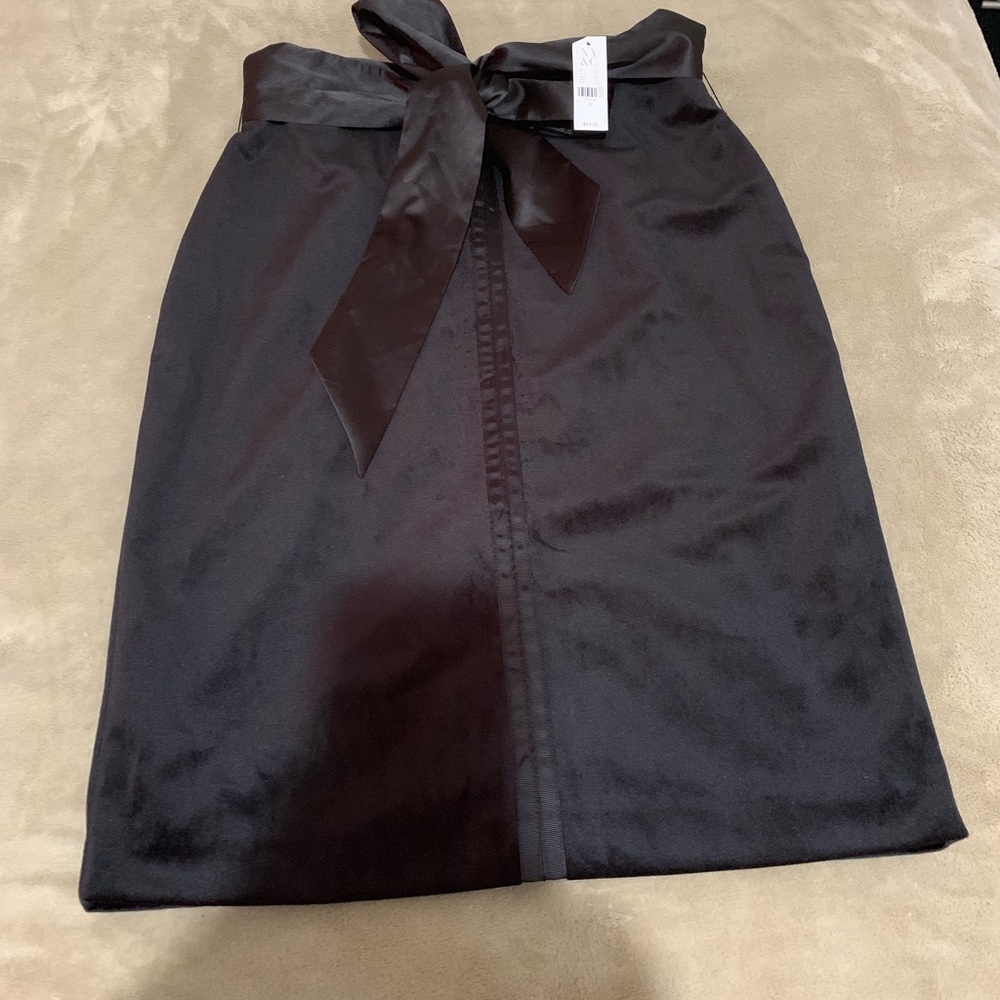 Black skirt with belt . Size 12 .